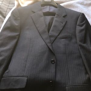 Men’s suit size 34R 100% wool, dark navy, worn  2x